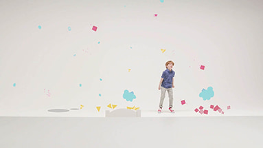 Still of the ubs film showing a boy with a blue shirt in a white space with colorful geometrical shapes and clouds flying around him.